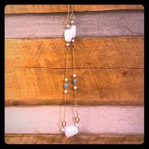 Gold toned blue beaded necklace